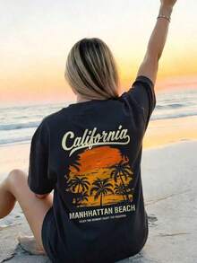 Break The SystemCamiseta de manga corta estilo retro americano para mujer, 100% algodón, corte holgado, estampado de puesta de sol en la playa de Manhattan y cocoteros, texto de California, top casual transpirable, ropa de uso diario para viajes por California, patrón de letras,  de playa de verano para mujeres adultas, camiseta de cuello redondo y corte holgado. - Negro - Ver 6