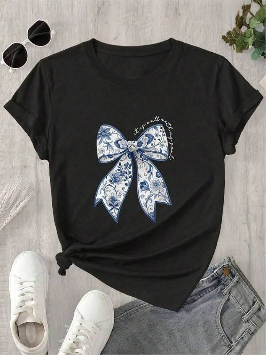 Camiseta negra informal de manga corta con cuello redondo para hombre,Camisetas Para Mujer Camiseta moderna con diseño de lazo elegante, estampado artístico, algodón suave, manga corta, estilo casual, ideal para mujer, disponible en negro, talla S a XL, moda urbana,  actual. - Negro - Ver 1