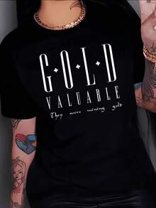 The Large Letters G.O.L.D VALUABLE Represent The Inner Strength And True Value That Each Person Possesses, Revealing An Inspiration About How What Is Essential Is Worth More Than What Is Material. A Modern, Casual, Comfortable Women's T-Shirt For Everyday Wear. - 黑色 - 查看 8