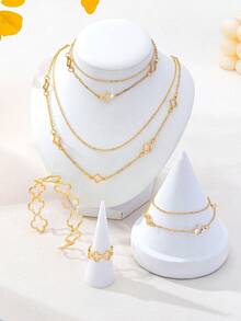 Bộ 5 món trang sức hình cỏ ba lá thanh lịch: Dây chuyền mặt dây hình cỏ ba lá rỗng, vòng tay mặt dây hình cỏ ba lá nhiều lớp, vòng đeo tay hình cỏ ba lá hở, nhẫn hình cỏ ba lá hở, lắc chân hình cỏ ba lá nhiều lớp, phù hợp với trang phục thường ngày và ngày lễ của phụ nữ. - Vàng - Xem 3