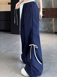 Women's Wide-Leg Trousers With Adjustable Drawstring, Loose Fit And Inspired By Urban Fashion, With Belt Loops And Pockets, Made Of Polyester Fabric With Bow Detail. - Navy Blue - View 1
