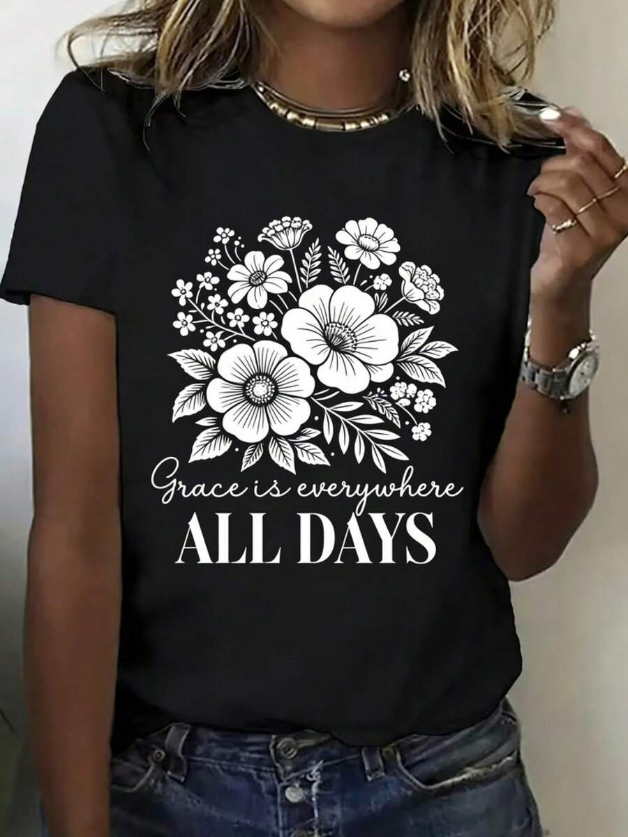Women's Summer T-Shirt With White Floral Print "Elegance Is Everywhere, Every Day". This Fashionable Women's Top Is Made Of Pure Cotton, Features A Round Neck, Short Sleeves, And Is Casual, Breathable, And Soft. A Must-Have For Everyday Wear, It Makes The Perfect Gift For Her. This Printed, Simple, Versatile, Loose-Fitting Top Has A Round Neck. - 黑色 - 查看 1