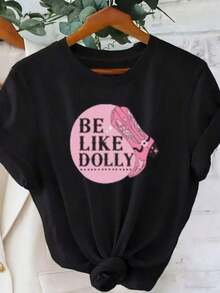 Premium And Comfortable White T-Shirt, Printed With The Pink "BE LIKE DOLLY" Pattern, High Heel Illustration, Knot Detail, Casual Round Neck, Can Be Hung On A Wooden Hanger, Summer T-Shirt, Suitable For Everyday Wear, Gift Idea - 黑色 - 查看 1
