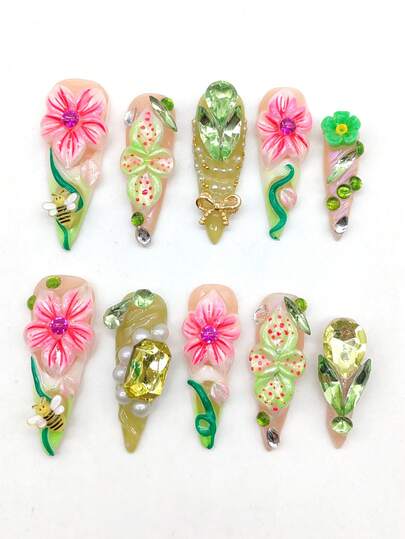 A Set Of 10 Pieces Of Pure Hand-Pressed Wearable Nail, 45mm Length Thin High-Heeled Pointed Nail Piece, Pink Nail Piece, White And Green Contrast Color, Three-Dimensional Raised White Flower Pink Painting, Green Flower, 3D Green Small Flower, Green Large Rhinestone Decoration, Raised Green Line, Bee Jewelry, Golden Bow Jewelry. Cute Nail Pieces, Heavy Craftsmanship. It Is Suitable For Daily Leisure Vacations, Banquets, Parties, Shows And Other Activities.