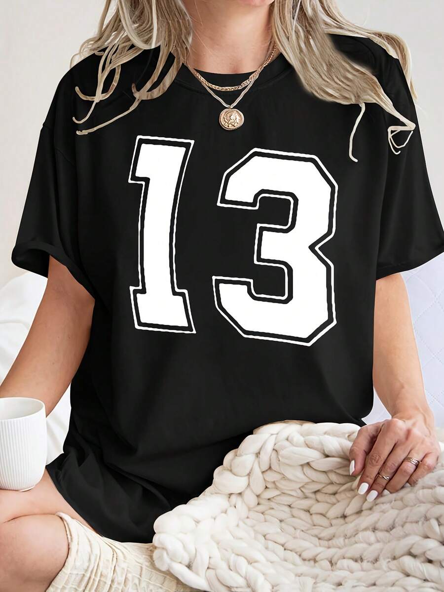 Casual T-shirtCamiseta deportiva minimalista para mujer número 13 - Blusa de manga corta con cuello redondo - Top compatible - No apta para gimnasio, entrenamiento, uso casual en primavera, verano y otoño.Lavable a máquina.Ropa deportiva para mujer100% CottonDurable - Negro - Ver 1