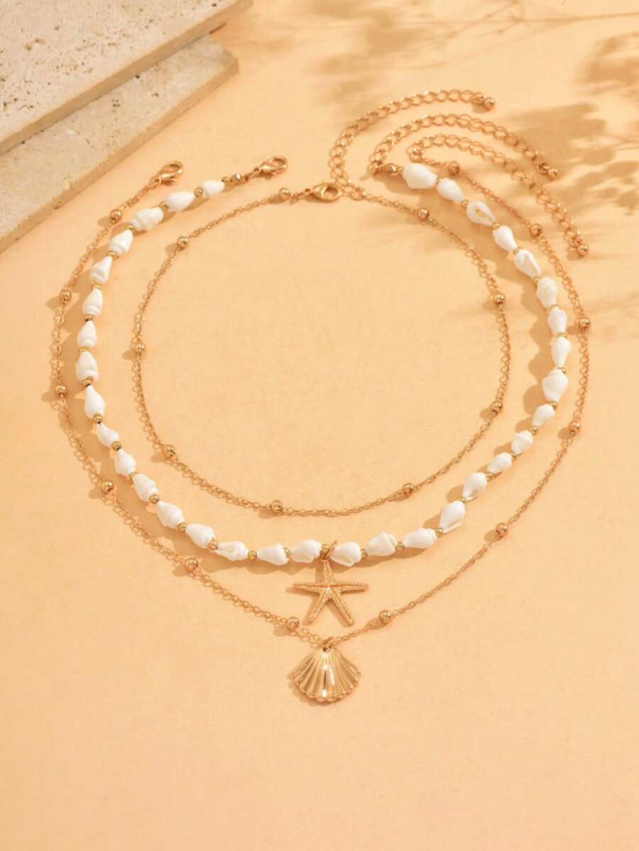 Bộ 3 vòng cổ hạt cườm vỏ sò tự nhiên cho kỳ nghỉ hè ở bãi biển, mặt dây chuyền hình sao biển vàng, dây chuyền kim loại thủ công, phụ kiện trang sức đa năng phù hợp để đeo hàng ngày và đi du lịch biển, hình dạng và họa tiết vỏ sò được chọn ngẫu nhiên. - Nhiều màu - Xem 1
