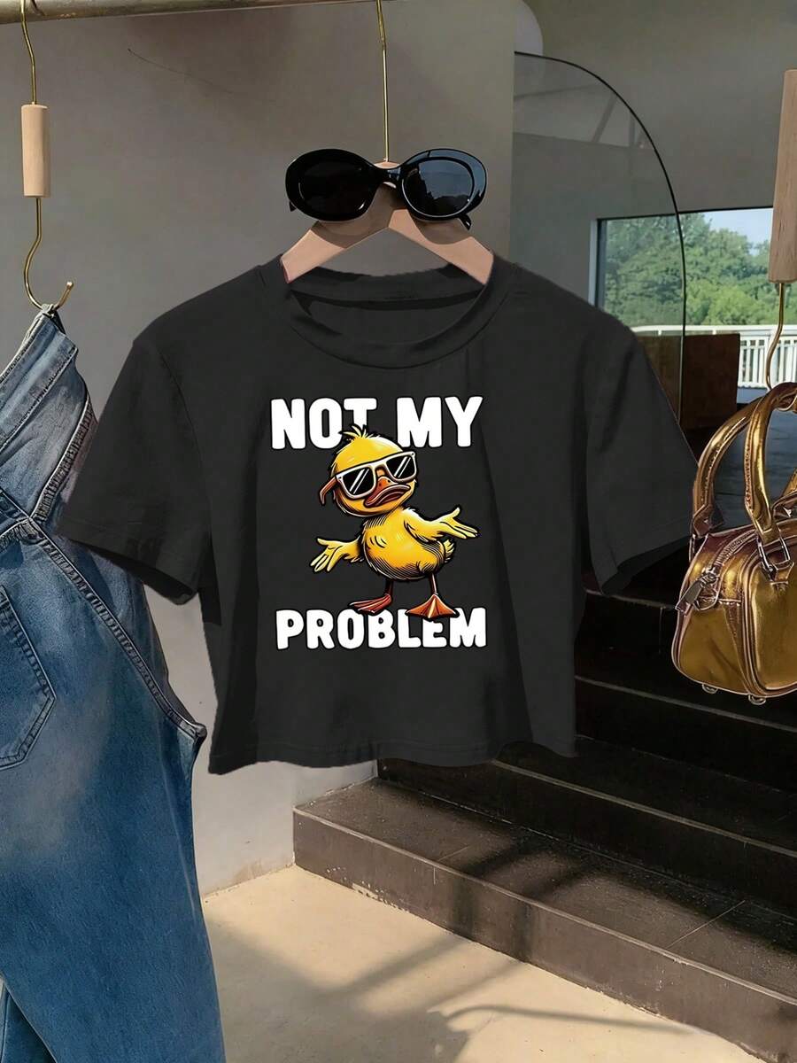Women's Short-Sleeved Crew Neck T-Shirt, Y2K Casual Fitted Crop Top, Stylish And Flattering, 100% Cotton, Machine Washable And Easy To Care For. Features A Fun Design With A Cartoon Duck Wearing Glasses And The Phrase 'NOT MY PROBLEM' - 黑色 - 查看 1