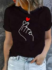 100% Algodón Premium 180g : Camiseta casual con estilo único y diseño de mano con corazón para mujeres modernas, ideal para salidas informales y eventos casuales, disponible en tallas S, M, L, XL en color negro, prenda esencial para tu guardarropa, camiseta a la moda.. Ropa de Moda Casual Suave y Transpirable para Diario - Negro - Ver 1