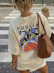 Camiseta de manga corta con cuello redondo y estampado de higo y aceituna "Puria" en color crema para mujer, corte holgado informal, estilo mediterráneo, estilo italiano, casual urbano, viajes culinarios, temporada de flores de cerezo, verano. - Albaricoque - Ver 5