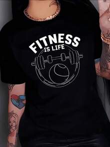 Una barra con pesas acompañada por una pelota simboliza la energía y la dedicación al ejercicio resaltando la fuerza interior y el equilibrio corporal camiseta de mujer cómodas para amantes del gimnasio y vida activa - Negro - Ver 8