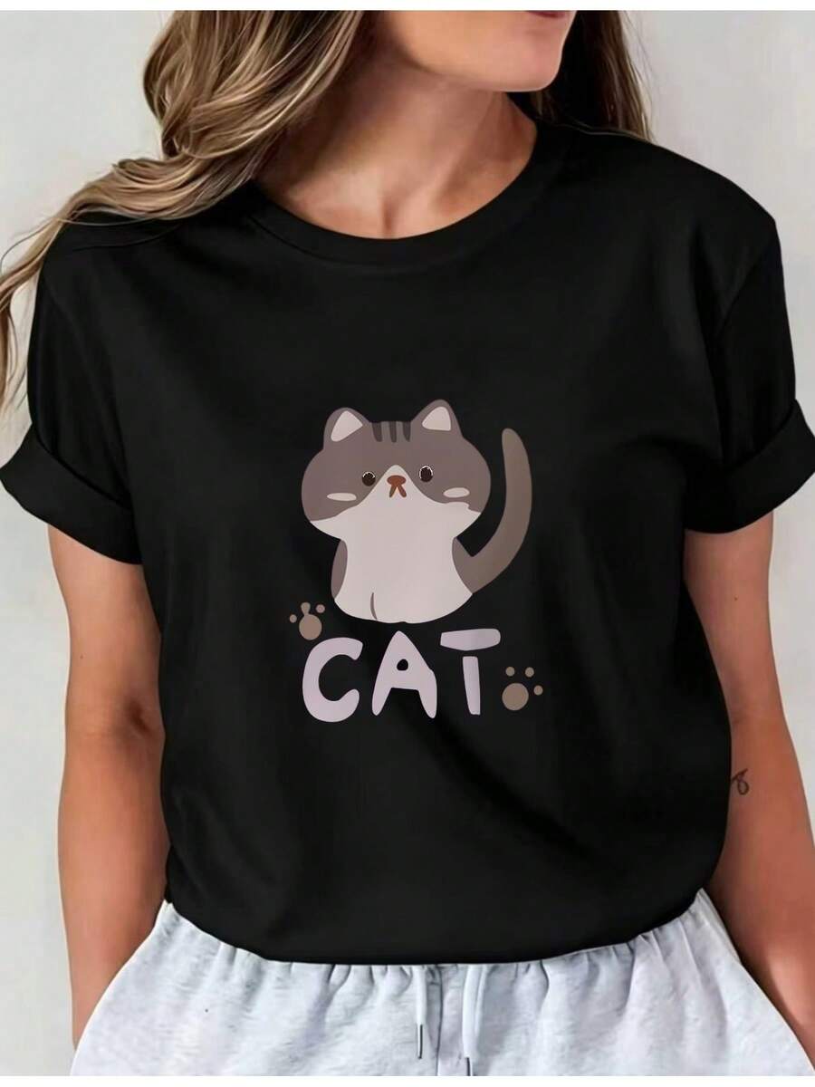 Camiseta suave para mujer con estampado de gato de dibujos animados, estampado de la letra CAT, cuello redondo de talla estándar, top casual I01, ropa cómoda para mujer, blusas elegantes para damas. - Negro - Ver 1