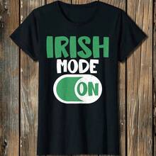 A Printed T-Shirt Made Of 180 G/M² Pure Cotton, Showcasing Irish Style With A Fun, Irish Flair. A Great Gift For Women, Featuring A Crew Neck Design. Breathable And Durable Fabric With A Special Weaving Technique. Soft, Easy To Clean, And Comfortable To Wear. Perfect For Irish Americans. Offers A Festive Style. - 黑色 - 查看 1