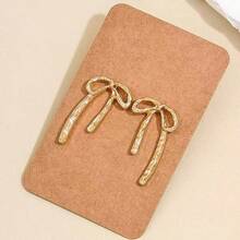 1 paire de boucles d'oreilles en métal doré en forme de nœud papillon, minimaliste et élégante, convient pour un port quotidien - Doré - Voir 1