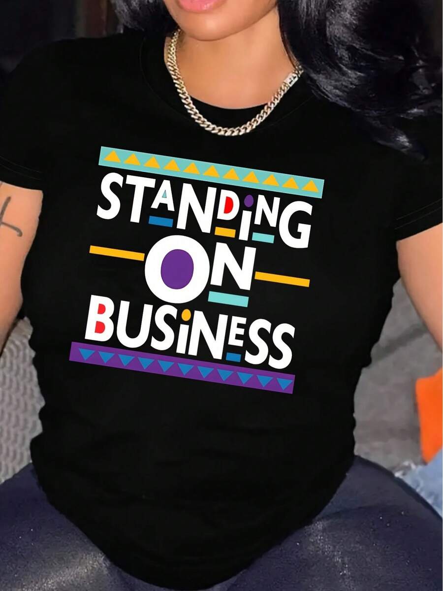 Camiseta Estampada para Mujer - Camiseta Casual de Manga Corta y Cuello Redondo en Negro con Diseño Colorido STANDING ON BUSINESS, Corte Relajado para Todas las Estaciones, Perfecta para el Uso Diario y Ocasiones Especiales (Lavable aáquina). - Negro - Ver 1