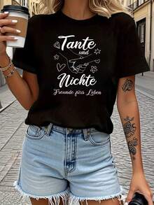 Camiseta Ligera y Transpirable para Mujer con Diseño Creativo de Manos Entrelazadas y Decoración de Corazón y Flores, con Elegante Lema Familiar, Estampado de Letras, Cuello Redondo, para Primavera y Verano, Uso Diario, Casual, Versátil, Regalo para Fiestas, Compras, Reuniones, Salidas, Estilo Vintage Elegante y a la Moda, Ideal para Combinar en Primavera y Otoño. - Negro - Ver 1