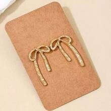 1 paire de boucles d'oreilles en métal doré en forme de nœud papillon, minimaliste et élégante, convient pour un port quotidien - Doré - Voir 3