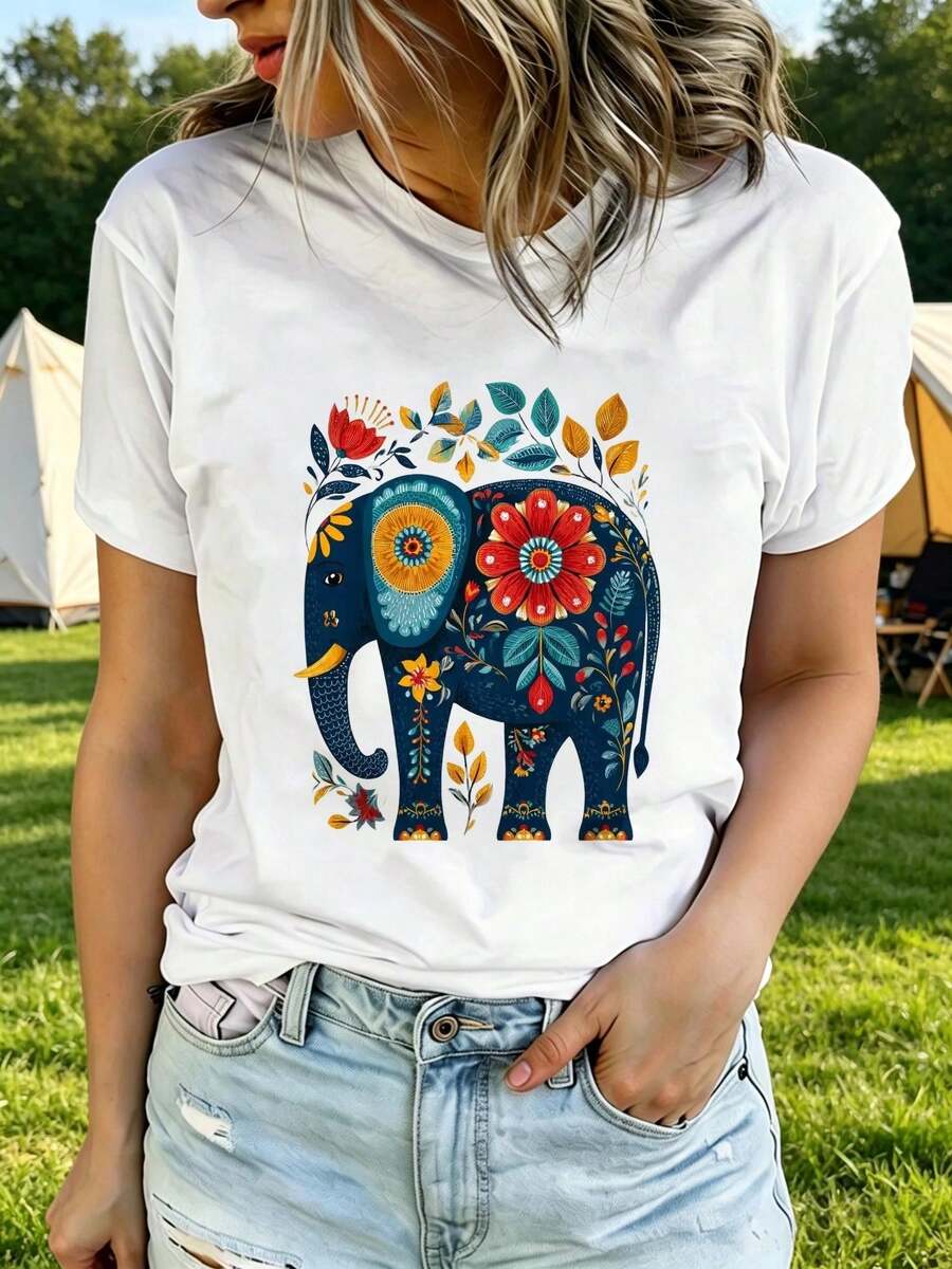 Camiseta Estampada para Mujer con Diseño de Elefante Floral - Camiseta Casual de Manga Corta y Cuello Redondo, Corte Relajado para Todas las Estaciones, Perfecta para el Uso Diario y Atuendos de Vacaciones (Lavable aáquina). Combínala con Pantalones Cortos de Mezclilla Desgastados. - Blanco - Ver 1