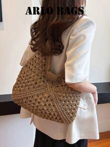 Questa borsa a spalla intrecciata è un must-have per le vacanze estive. Con il suo interno spazioso, il design traforato e le maniglie in pelle, è perfetta per le gite in spiaggia, lo shopping e i weekend fuori porta, rendendola una scelta ideale per gli appassionati di viaggi. - Cachi - Visualizzare 3