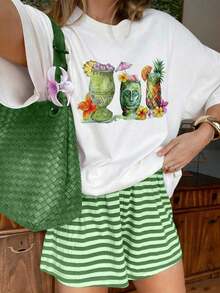 Suave, transpirable y ligera para comodidad durante todo el día. Camiseta casual con estampado floral de piña estilo tiki tropical. Cuello redondo clásico con un corte relajado que favorece todas las formas del cuerpo y es fácil de combinar con jeans, pantalones cortos y leggings. - Blanco - Ver 1