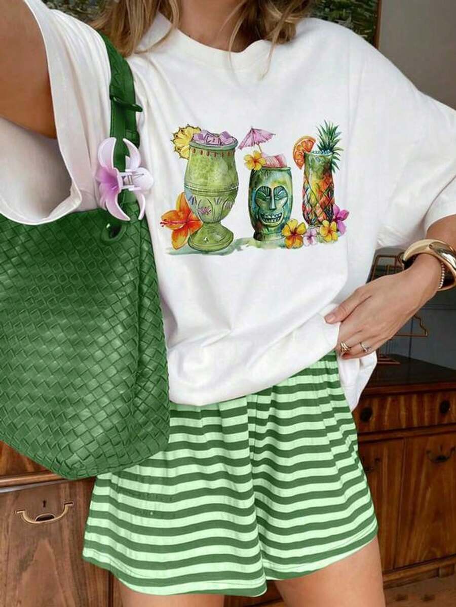 Suave, transpirable y ligera para comodidad durante todo el día. Camiseta casual con estampado floral de piña estilo tiki tropical. Cuello redondo clásico con un corte relajado que favorece todas las formas del cuerpo y es fácil de combinar con jeans, pantalones cortos y leggings. - Blanco - Ver 1