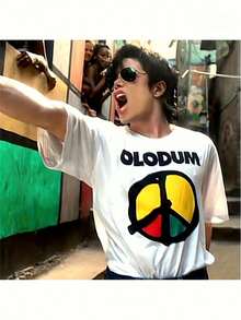 Camiseta Blanca Olodum para Hombre [Olodum Logo Tee] |   Camiseta Gráfica con Logotipo OLODUM en Negritas, Cuello Redondo Clásico, Ropa Urbana Casual, Camiseta Cómoda para Todas las Temporadas, para Atuendo Informal y Ropa de Seguidor - Blanco - Ver 1