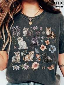 1 camiseta de mujer con estampado de gato y flores, que presenta un lindo retrato de gato rodeado de hermosas flores, celebrando el amor por los amigos felinos. Usa esta encantadora camiseta para mostrar una serie de adorables gatos, integrados en un vibrante diseño floral. 180g 100% Algodón - Negro - Ver 1