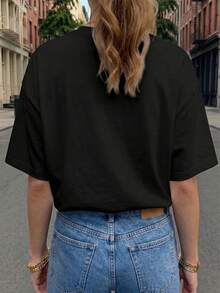 Suave camiseta básica de moda primavera/verano para mujer, de manga corta y cuello redondo, con un patrón abstracto de pétalos blancos, adornada con puntos naranjas, con un efecto de textura desgastada, adecuada para uso casual, se puede usar en casa o al aire libre, camiseta ajustada versátil en varios colores, material cómodo, para entusiastas de la moda, blusas elegantes para mujer. - Negro - Ver 2