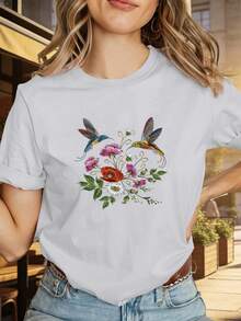 1 camiseta de manga corta con cuello redondo, estampado floral y de aves en negro - Prenda casual y cómoda, adecuada para uso diario, para usar en capas, lavable a máquina - Un elemento esencial del guardarropa tanto para atuendos de oficina como de fin de semana, 100% algodón de 180g. - Blanco - Ver 1