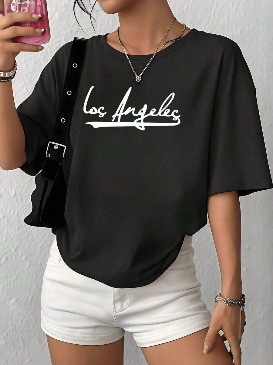 100% Cotton. The Word On The T-Shirt Symbolizes The Creative Energy And Free Spirit Of A City Full Of Dreams And Constant Movement. Women's T-Shirt, 100% Soft Cotton, Comfortable And Modern Cut For Everyday Wear. Women's Simple Solid Color T-Shirt, Loose And Slim Fit Casual Short Sleeve - 黑色 - 查看 1
