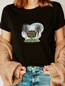 Premium Black T-Shirt With A Design Of Two Palm Trees And Yellow Lettering On A Black Background, With Green Grass And A Blue Sky In The Background. New Women's Summer T-Shirt, Casual And Comfortable With A Round Neck. Gift Idea. - 黑色 - 查看 1
