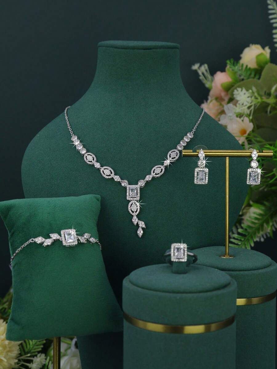 Bộ trang sức cưới 5 món mạ vàng trắng sang trọng kiểu hoàng gia, thiết kế hình học, đính đá Cubic Zirconia trắng thủ công, bao gồm dây chuyền, vòng tay, bông tai và nhẫn, thích hợp đeo hàng ngày và làm quà tặng cưới, kỷ niệm ngày cưới.