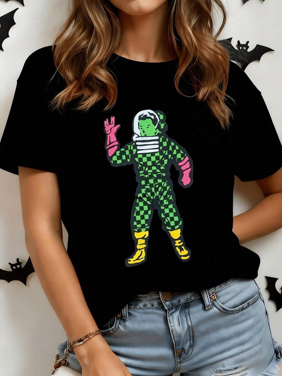 Astronaut Figure In Green Plaid Suit And Pink Gloves Waving In A Friendly Pose, Evoking A Cheerful Cosmic Adventure. Modern, Comfortable Casual Women's T-Shirt - 黑色 - 查看 1