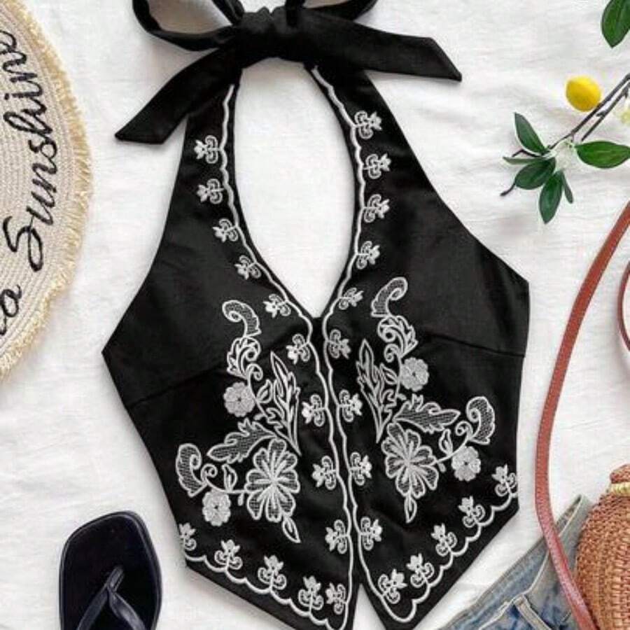 Top corto con escote halter, espalda descubierta y lazo, con bordado floral, adecuado para festivales de música - Blanco y Black - Ver 1