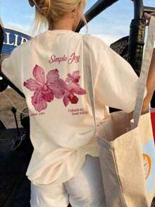 This Short-Sleeve Crew Neck T-Shirt With A Colorful Letter And Floral Print Is A Fashionable And Versatile Choice For Women In Summer. The Graphic Tee Comes In White And Pink, Perfect For Vacation Wear. 100% Cotton - 杏 - 查看 1