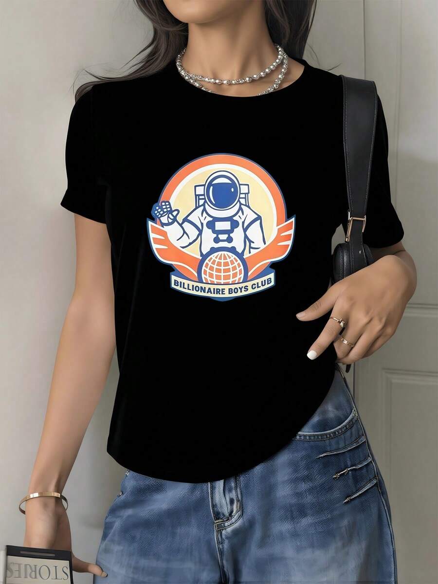 Astronaut On An Orange Background Symbolizing Exploration And Dreams That Connect Humanity With The Universe And Hope. Comfortable Modern Women's T-Shirt For Everyday Wear. - Black - View 1