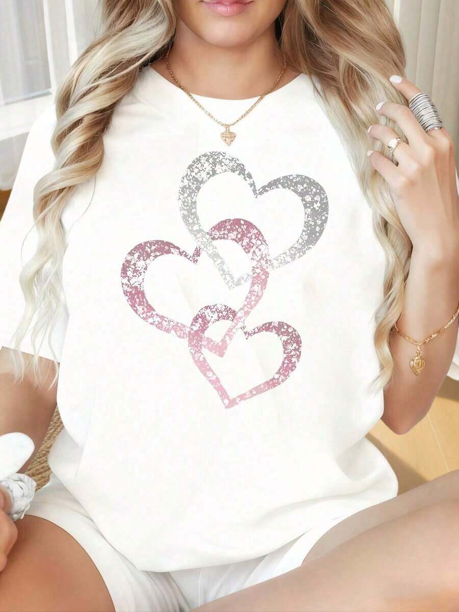 Camiseta de mujer a la moda con cuello redondo y mangas cortas, estampado divertido de corazón con brillo. Camiseta casual de corte holgado para mujer, top de manga corta con diseño gráfico de moda para uso diario. Adecuada para el Día de San Valentín, Navidad, fiestas, actividades deportivas, vacaciones, salidas, deportes y otros regalos festivos.Ropa de uso diario - Blanco - Ver 1