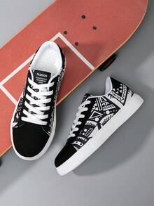 Zapatos de lona con estampado de graffiti aleatorio en blanco y negro, de estilo clásico y unisex, zapatillas de skate ligeras y casuales para todas las estaciones - Blanco y Negro - Ver 7