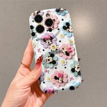 Officially Licensed Disney Mickey Mouse & Minnie Mouse Phone Case, This Protective Phone Case Features A Whimsical Print Of Mickey And Minnie Faces Nested Inside Pastel‑Hued Floral Shapes, Mixed With Daisy Blooms, Black Star And Pink Butterfly Details Plus The Bold "MASTERPIECE" Text Against A Clean White Base, Made With Flexible, Durable TPU Material To Protect Against Everyday Scratches, Bumps, And Minor Impacts, With A Raised Camera Frame For Extra Lens Protection, Slim And Lightweight Construction That Adds Minimal Bulk And Fits Easily In Pockets And Bags, Compatible With IPhone 17, 16, 15, 14, 13, 12, 11 Pro Models, Making It A Charming Choice For Disney Fans, Ideal For Birthdays, Holidays, Or Any Special Occasion To Surprise Family And Friends. - trắng - Xem 2