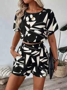 Camisa de mujer con hombros caídos, cintura ceñida y dobladillo, y shorts de mujer decorados con bolsillo, estampado floral, conjunto elegante casual de vacaciones - Blanco y Negro - Ver 3