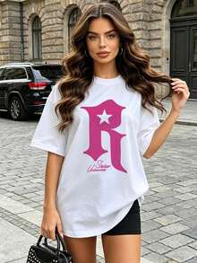 Camiseta de manga corta con cuello redondo suave y casual para mujer, con estampado gráfico de la letra R en forma de estrella, adecuada para uso diario en primavera y verano. Blanca. - Negro - Ver 2