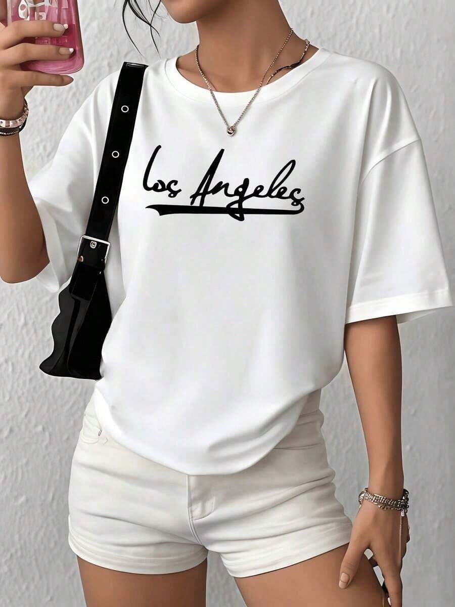 100% Cotton. The Word On The T-Shirt Symbolizes The Creative Energy And Free Spirit Of A City Full Of Dreams And Constant Movement. Women's T-Shirt, 100% Soft Cotton, Comfortable And Modern Cut For Everyday Wear. Women's Simple Solid Color T-Shirt, Loose And Slim Fit Casual Short Sleeve - 白色的 - 查看 1