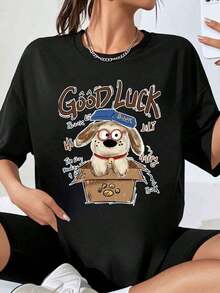 "Good Luck Dog In Box" Graphic T-Shirt With A Cute Cartoon Puppy Wearing A Blue Hat And Glasses, Oversized T-Shirt For Women, Summer Casual Wear, Gift For Dog Lovers, Outfit For Birthdays And Parties. - 黑色 - 查看 7