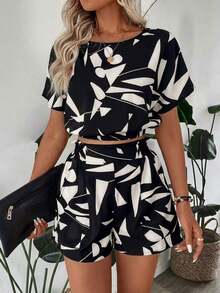 Camisa de mujer con hombros caídos, cintura ceñida y dobladillo, y shorts de mujer decorados con bolsillo, estampado floral, conjunto elegante casual de vacaciones - Blanco y Negro - Ver 4