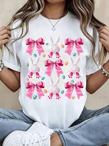 Nueva Camiseta de Moda para Mujer con Cuello Redondo, Estilo Casual, con Estampado de Conejo de Pascua con Lazo Rosa y Huevos, Manga Corta, para Primavera y Verano. Diseño versátil y listo para el verano. - Blanco - Ver 1