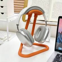 這款耳機架簡單實用，適用於各種類型的耳機。圓弧設計可均勻支撐頭帶，確保穩定不搖晃。底部的防滑墊可將其牢牢固定在桌面上，防止滑動。 - 彩色 - 查看 5