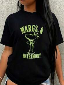Camiseta Blanca 100% Algodón para Mujer con Divertido Estampado de Margaret y Matrimonio | Camiseta negra con diseño de copa de margarita verde - Corte holgado, adecuada para fiestas informales como despedidas de soltero, bodas y noches de margarita - Lavable a máquina, adecuada para primavera y verano, manga corta 2026 - Ropa de verano para mujer, blusas estilo Y2k para mujer, ropa casual para mujer. - Negro - Ver 1