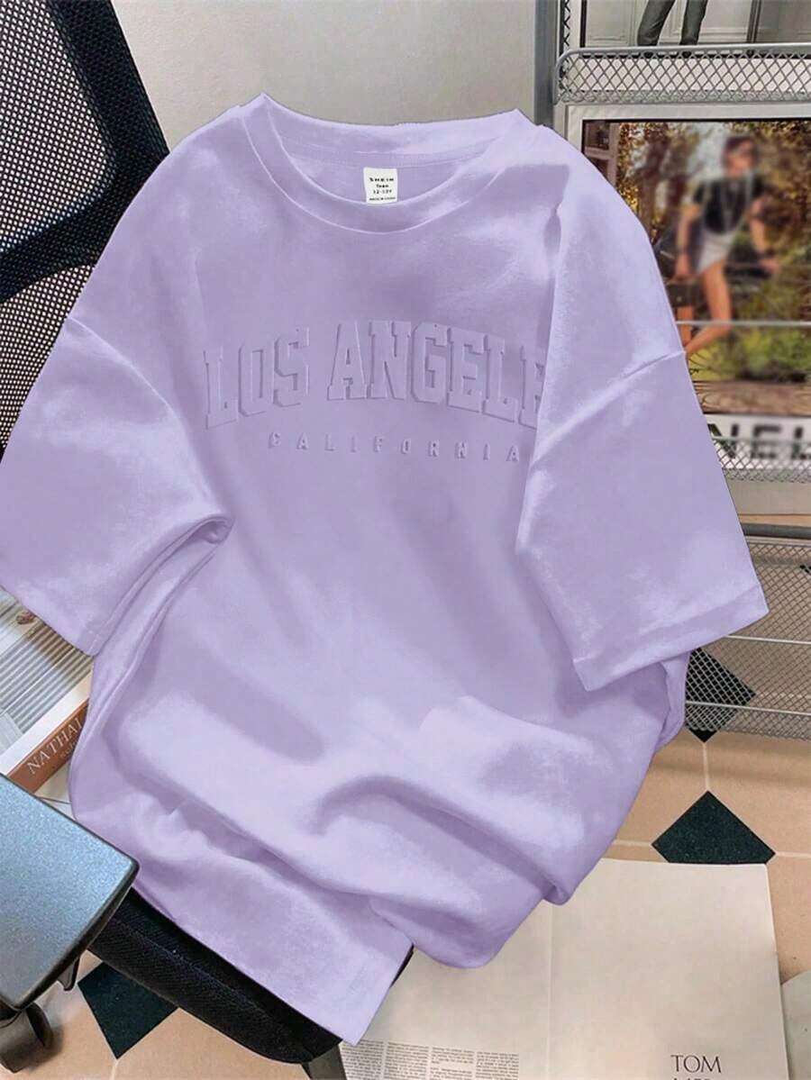 Camiseta de corte holgado con cuello redondo y manga corta, con estampado de patrón Milano, estilo casual para mujer, para el verano. - Parma - Ver 1