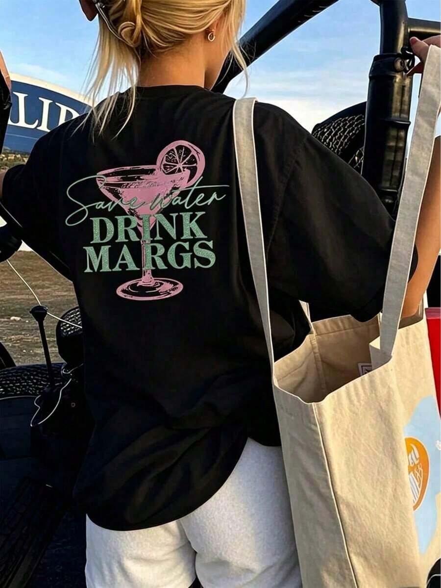 ropa de mujer 100% Algodón, Top Blanco para Mujer, Camiseta Blanca de Corte Holgado - Estampado de Margaritas Festivas, Top de Baño de Manga Corta con Cuello Redondo, Estilo Casual de Verano, Tela Ligera y Transpirable, Adecuado para Fiestas y Uso Diario (Primavera y Otoño) - Diseño Divertido "Save Water Drink Margs" 2026 - Conjuntos de Verano para Mujer, Camisetas Y2k para Mujer - Negro - Ver 1