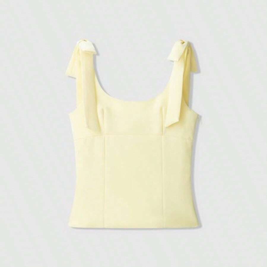 Top casual sin mangas con cuello redondo oversize en color amarillo mantequilla con decoración de lazo - Amarillo - Ver 1