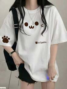 Camiseta de manga corta informal de cuello redondo y corte holgado para mujer, estilo japonés, con estampado de gato de dibujos animados y letras, color blanco, para primavera y verano. - Blanco - Ver 8
